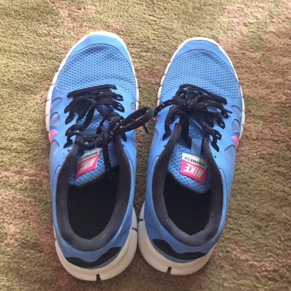 Blue and pink Nike free 5.0