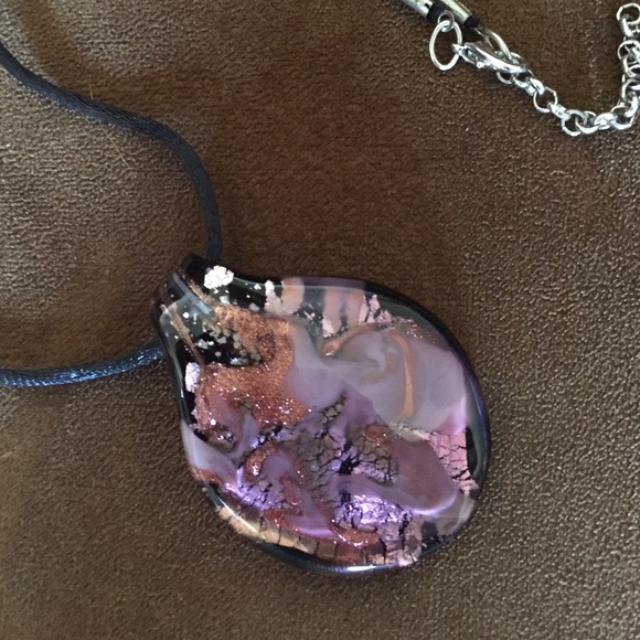 Murano glass pendant on cord.