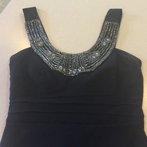 Black fitted mini dress with embellishment