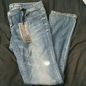 Converse One Star Distressed Skinny Jeans