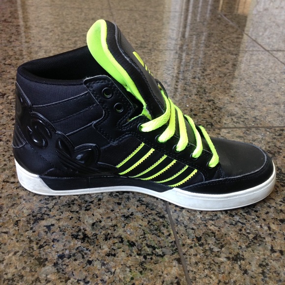 Black and lime green Adidas sneakers