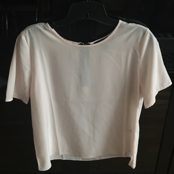 A sheer material pink blouse