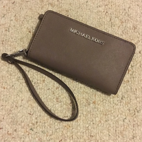 Michael Kors wristlet that holds IPhone 6