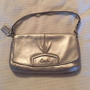 Silver Coach clutch.