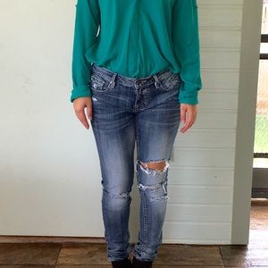 Distressed denim skinny jeans