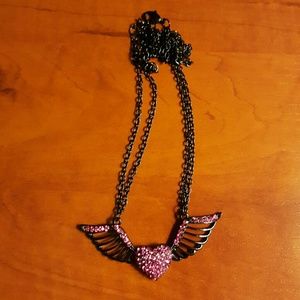 Black necklace with pink winged heart