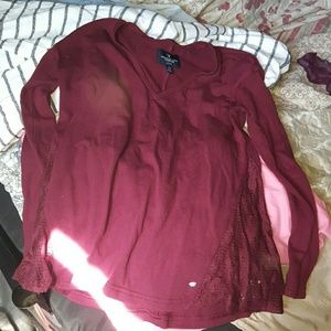 Burgandy American eagle shirt.