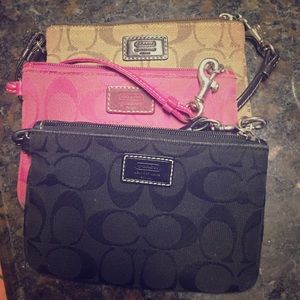 Coach wristlet purses.