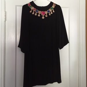 Black dress with necklace detail