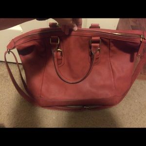 Rust color leather handbag
