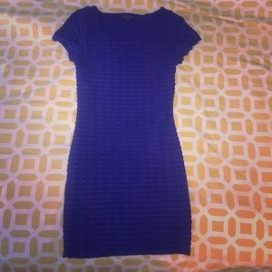 A blue tight fitting evening dress