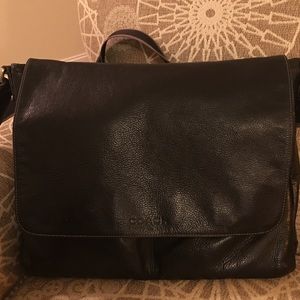 Coach messenger bag in black.
