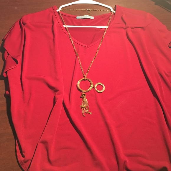 Red blouse with necklace