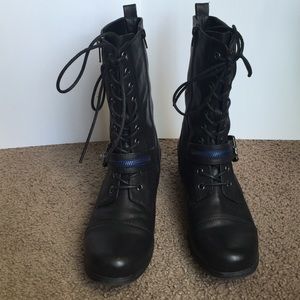 Lace up combat boots with accent zippers