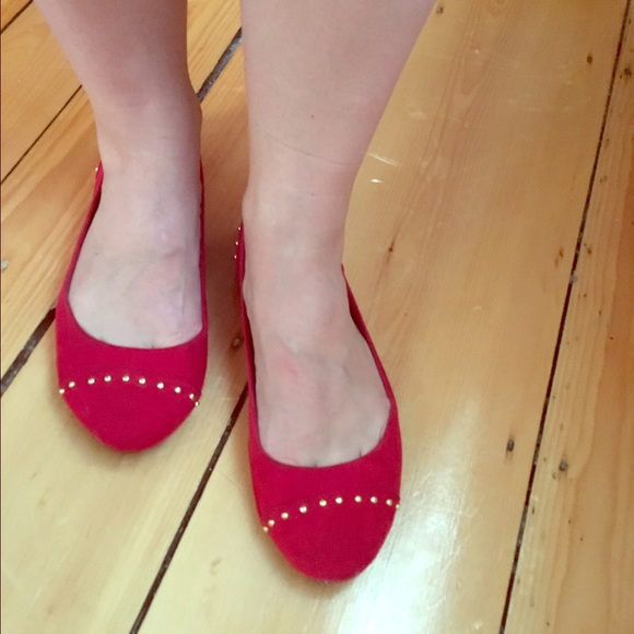 Red flats with gold stud details