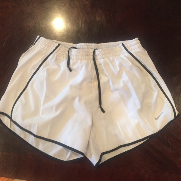 White Nike running shorts