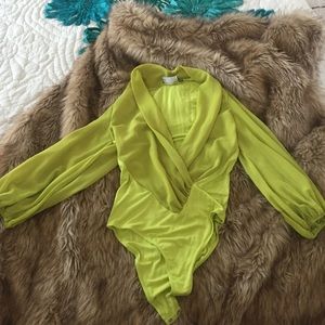 Green blouse jumpsuit with plunging neckline