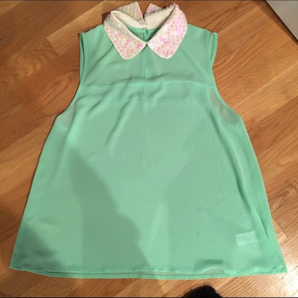 Brand new blouse with PeterPan sequin neckline