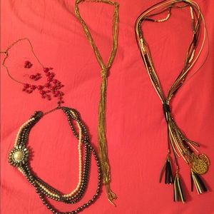 Four necklaces and one pair of matching earrings