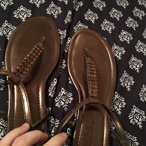 Women's size 9 gold sandals.