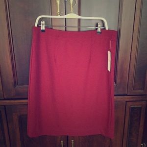 Burgundy/maroon skirt.