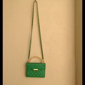 St. John emerald green shoulder and arm bag.