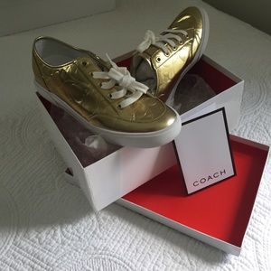 Coach sneakers in gold