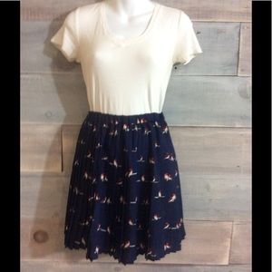 Navy pleated birdie skirt.