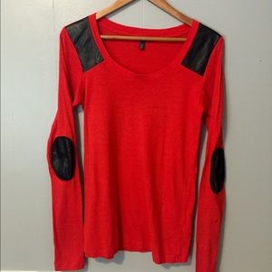 Red top with faux leather details