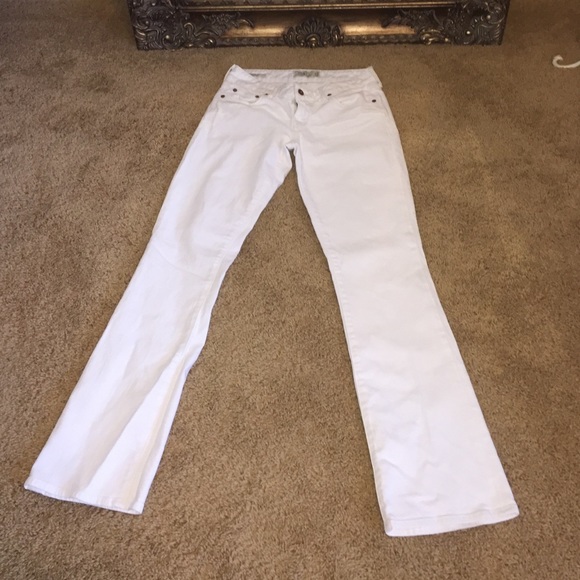 White boot-cut jeans.