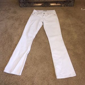 White boot-cut jeans.