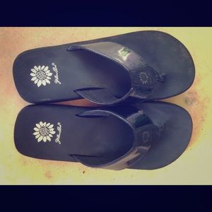 Yellow box black flip flops