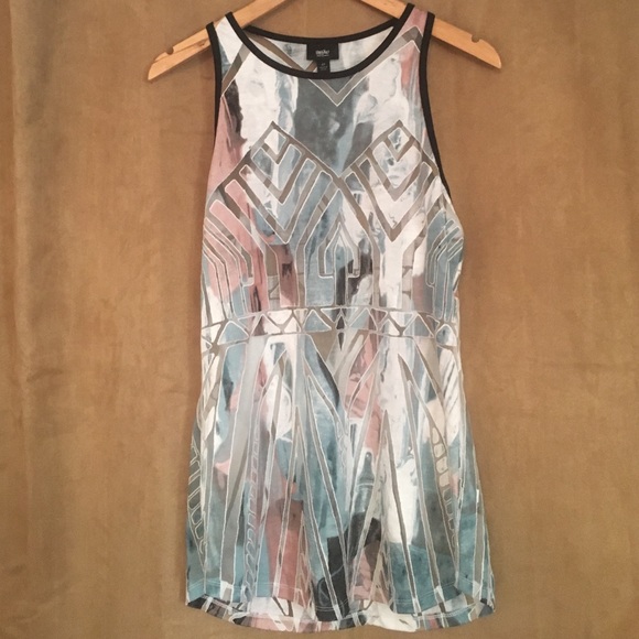 Multi colored tank top with a black lining.