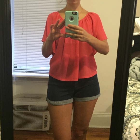 Coral blouse with flowy sleeves