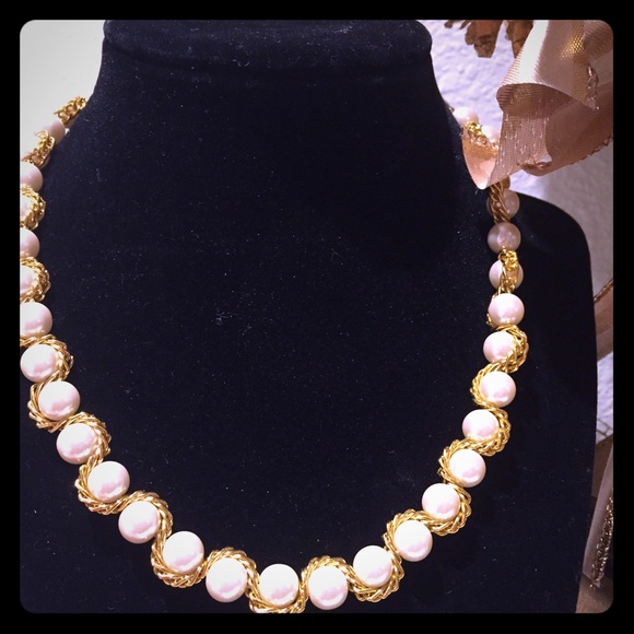 Slick faux pearls and gold strand necklace