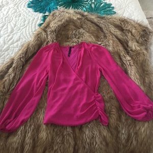 Pinkish purple blouse with plunging neckline