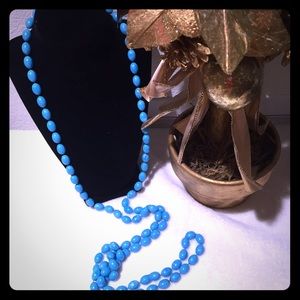 Turquoise color beads. Long draping necklace