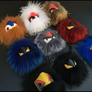 Fendi puff ball keychains.