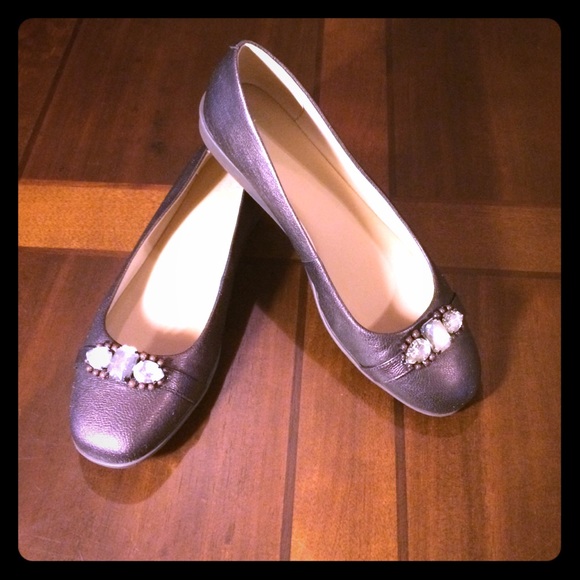 Pair of dark brown shoes with jewels