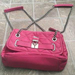 Hi I'm selling a pink purse it's a Nine West purse