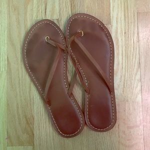 Brown leather flip flop sandals