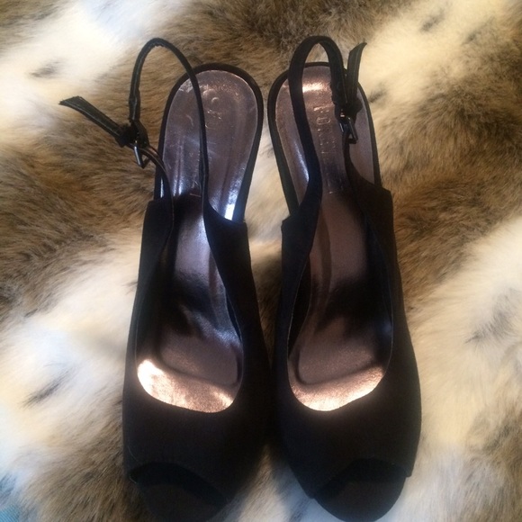 Black peep toe platforms with studded heels