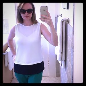 The limited, small cream and navy color block tank