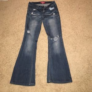 Ripped bell bottom jeans