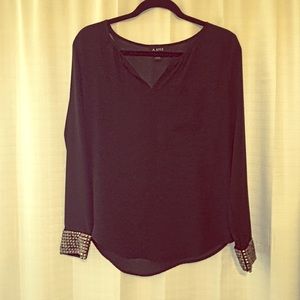 Sheer black long sleeve blouse with gold studs Sheer black long sleeve blouse with gold studs