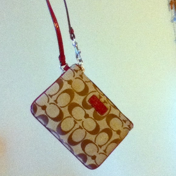 Coach wristlet with red details