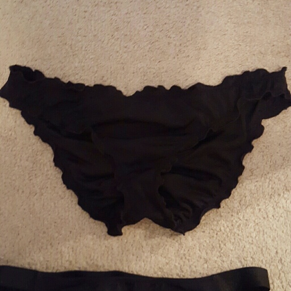 2 black VS swimsuit bottoms