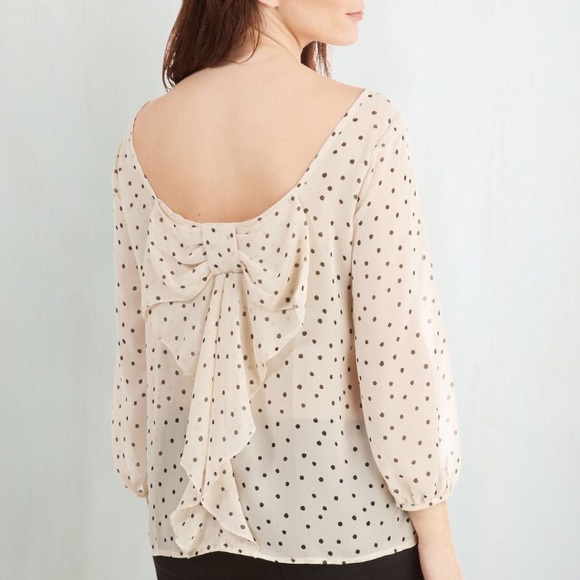 Reversible polka dot blouse.