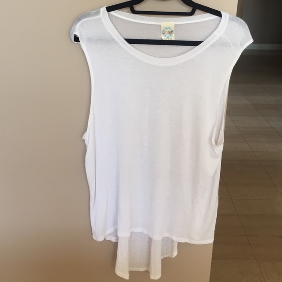 White tank long in back. Runs big