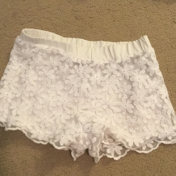 I am selling white flowy shorts